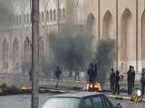 معترضان درب مرقد شهید حکیم را آتش زدند