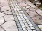 اجرای سنگ لاشه سنگ ورقه ای 09126718261 درحال انجام کف حیاط در شهریار