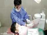 کشیدن دندان شیری همراه با کنترل رفتاری ( دکتر زارعیان )