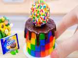 Decorated with 1000 Mini Kitkat Bars  this Miniature Rainbow Chocolate Kitkat Cake is sure to satisfy.