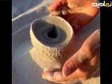 ساخت ظرف ماسه ای در کنار دریا